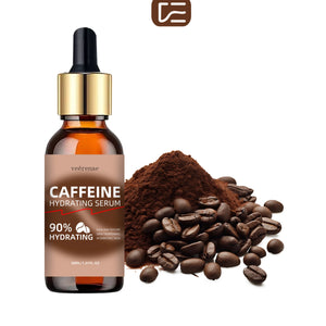 Caffeine hydrating serum bottle with coffee beans and grounds on a white background