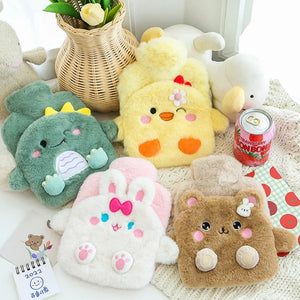 Set of cute plush toys including a green dinosaur, yellow chick, white bunny, and brown bear on a soft surface.