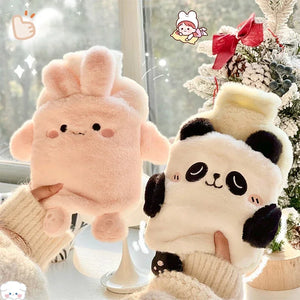 Two plush toys, one pink and one panda, held by hands with a Christmas tree in the background.
