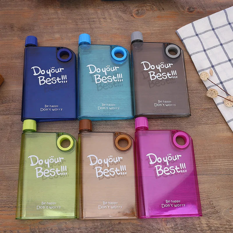 Five colorful water bottles with 'Do your Best!!' text on a wooden surface.