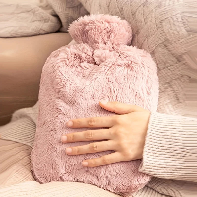 Person holding a pink fluffy hot water bottle on a soft surface